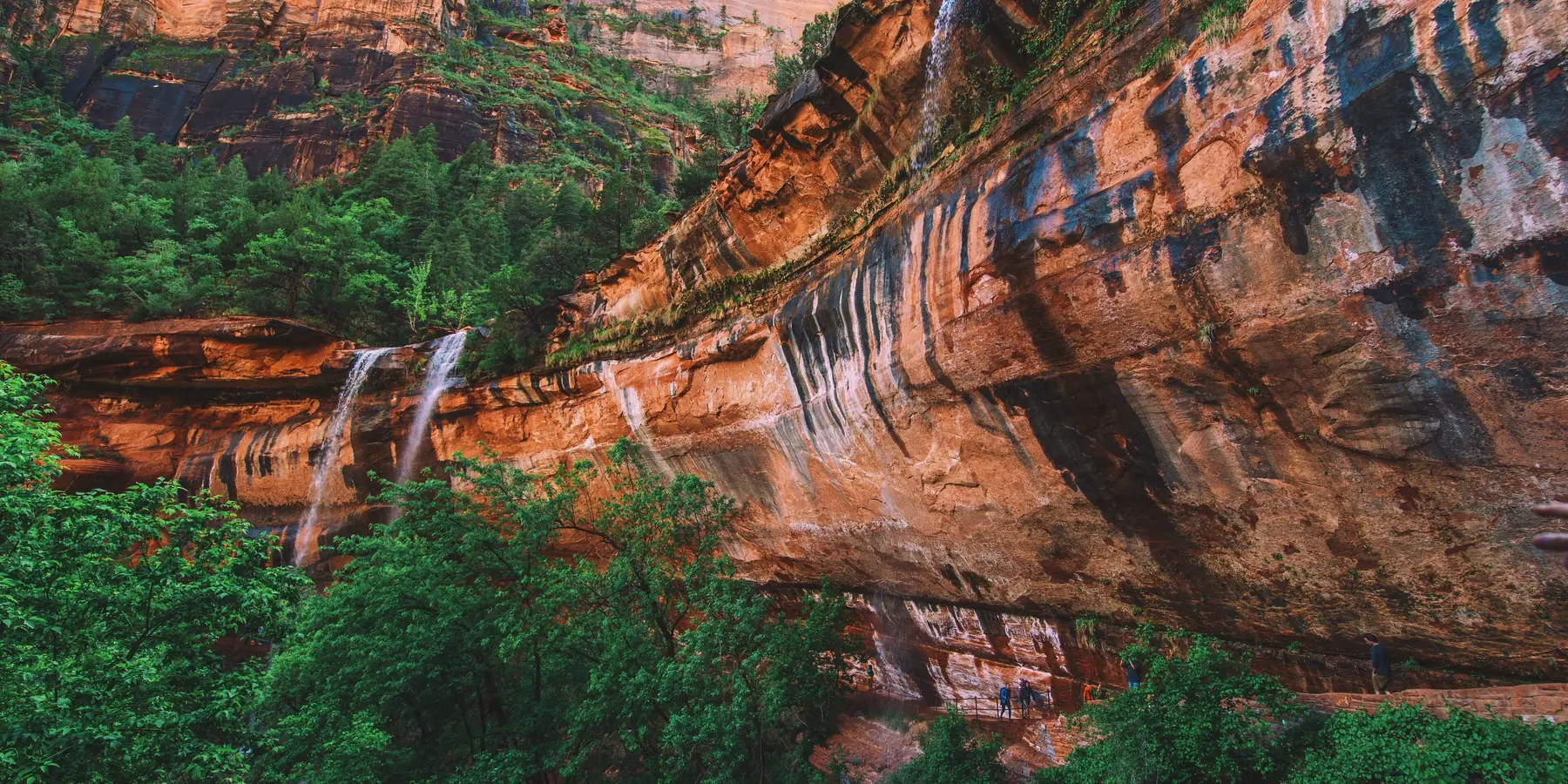 Waterfalls spilling over sandstone at Emerald Pools.